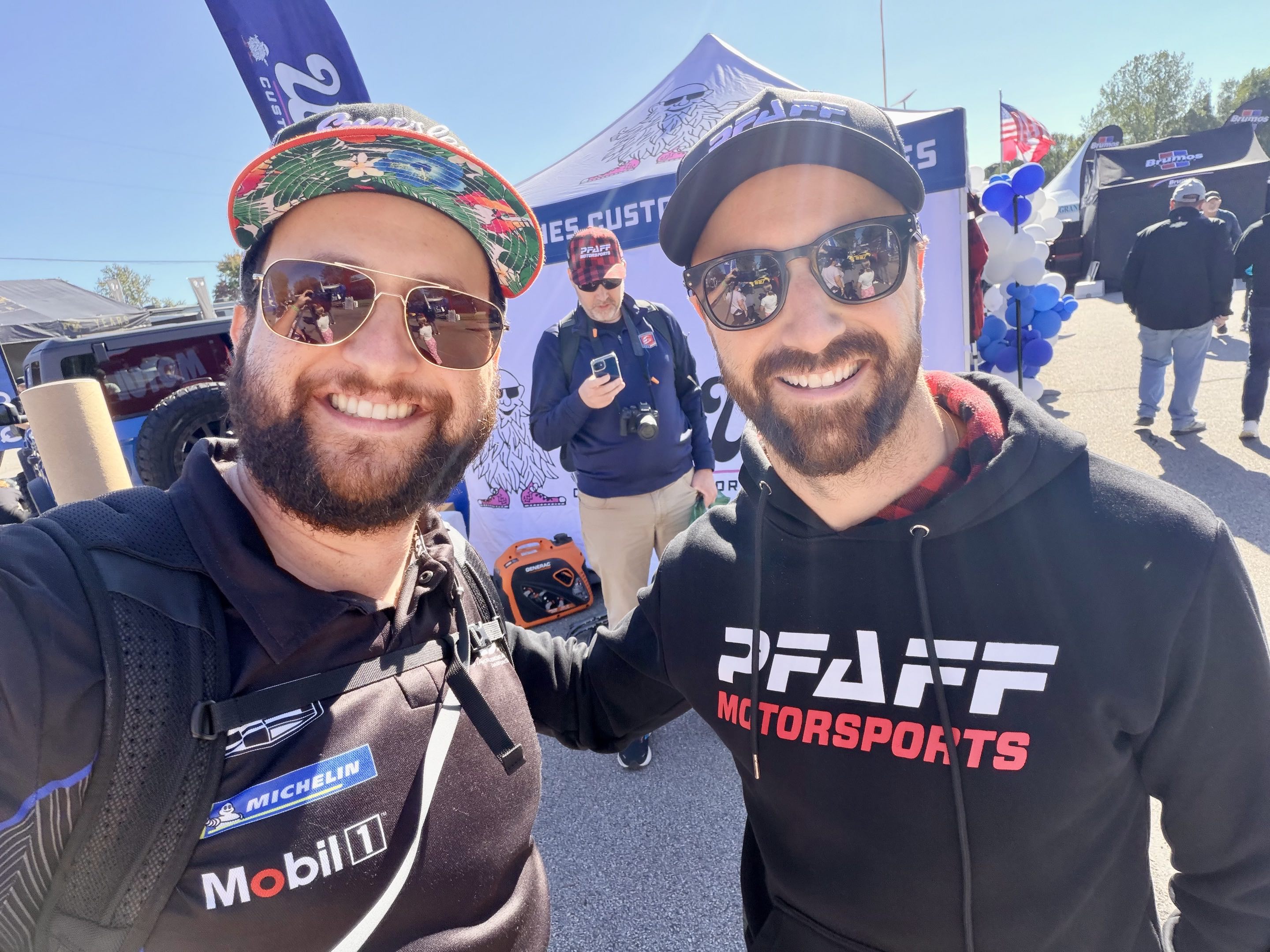 Two late-thirties men in racing clothes with beards and sunglasses